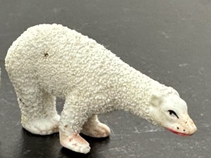 lot 66 image: Antique Victorian Snow Baby on Polar Bear and Antique Snow Baby Polar Bear Figurine