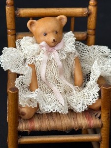 lot 57 image: Miniature Doll and Teddy Bear on Rocking Chairs
