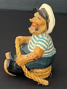 lot 23 image: Vintage Hand Carved Wood Norwegian Sly Fisherman Figurine