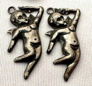 lot 404 image: Three Vintage Sterling Charms including Two Angel Sterling Charms and One Cupid Charm