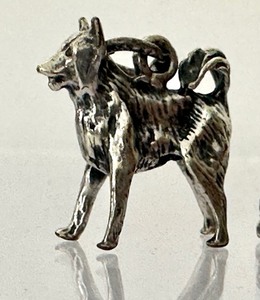 lot 405 image: Two Vintage Dog Figurine Charms