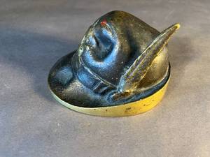 lot 50 image: old brass feathered cap paperweight