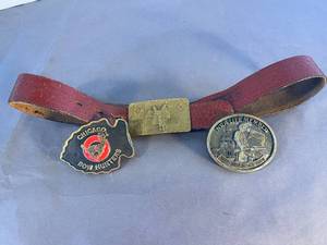 lot 52 image: tooled leather belt and 3 brass buckles