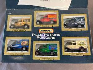 lot 67 image: Matchbox Pills, Potions, & Powders delivery trucks & FAO Schwartz Matchbox collectible ornaments - new in box