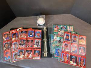 lot 75 image: Minnesota Twins album of baseball cards  a Rawlings Official MLB baseball, new in case