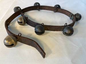 lot 94 image: antique brass sleigh bells on leather strap
