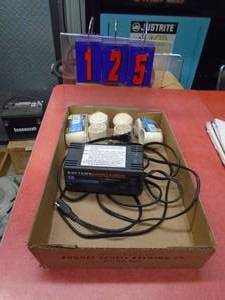 Flat of 612 volt battery tender. No clamps. As shown.