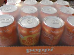 lot 215 image: 12 pack Poppi Prebiotic Orange Soda...