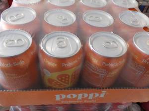 lot 216 image: 12 pack Poppi Prebiotic Orange Soda...
