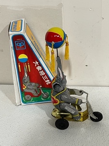 Collectible Wind-Up Elephant on Bike
