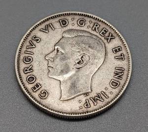 lot 138 image: Canadian Silver Quarters and Fifty Cent Coin