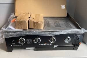 lot 97 image: Blackstone 36 Black 4-Burner Propane Outdoor Flat Top Griddle Cooking Station with Built-in Cutting Board, Garbage Holder and Side Shelf