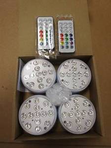 lot 844 image: 4 Pack LED Puck Lights with 2 Remotes (OPEN BOX)