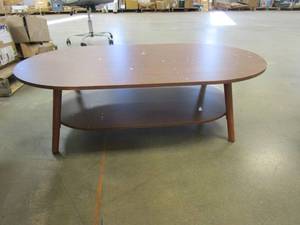 lot 855 image: Small Oval Coffee Table in Brown (SEE PHOTOS, SOME AREAS ARE CHIPPED AND DAMAGED)
