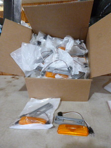 Case of Peterson Manufacturing Amber Marker Lights
