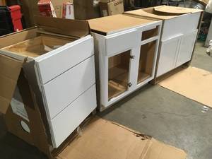 lot 29 image: Mix lot of White Storage Cabinets, Customer returns Review all pictures