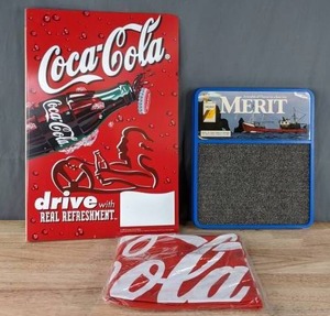 lot 110 image: Coca Cola Inflatable Football and Merit Cigarettes Cash Register Sign  U