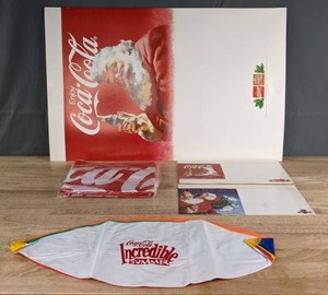 lot 156 image: Coca Cola Advertising Material with Santa, includes Inflatable Beach Ball and Football  U