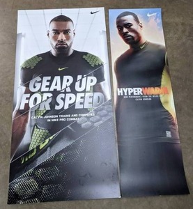 lot 119 image: Nike Advertising NFL Detroit Lions Calvin Johnson Football Banners, 74 x 36.5 & 72 x 22 U