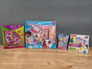 lot 142 image: New Doc McStuffins All Better Game, Minnie Cosmetic Set, Little People Cinderella Coach and Little Kingdom Cinderella  W