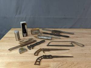 lot 234 image: A Collection of Vintage Saws, Bone Saws, Knives and More  M