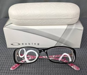 lot 31 image: New Oakley Breast Cancer Awareness Edition Eyeglass Frames with Display Lenses, Hard Case and Soft Side Bag  L