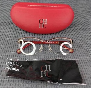 lot 88 image: New Carolina Herrera Eyeglass Frames with Display Lenses, Case and Cleaning Cloth  L