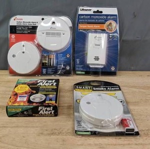 lot 141A image: Kiddle Carbon Monoxide & Smoke Alarm Value Pack, Life Saver Carbon Monoxide Alarm, Smart Electrician Smoke Alarm and First Alert Smoke & Fire Detector R