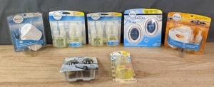 lot 400 image: Febreze Noticables Warmer, (3) Febreze Noticeables Refills, Febreze Small Spaces Air Freshener, Febreze Car Vent Clips and Febreze Oil Warmer R