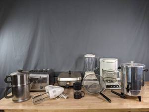 lot 301 image: A Collection of Small Kitchen Appliances Including a Blender, Hand Mixer, Coffee Pot, Toaster and More  R