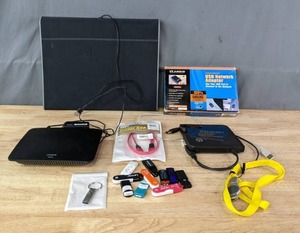 lot 356 image: Computer Accessories Linksys Ethernet Switch, Assorted Flash Drives, HP External USB Adapter and More R