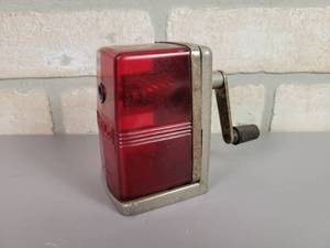 lot 53 image: Vintage Bostonette Red See-Through Pencil Sharpener