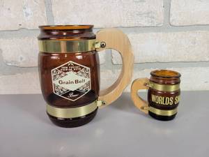 lot 87 image: Vintage Fiesta Ware Grain Belt Beer Mug and Worlds Smallest Beer mug