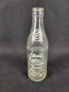 lot 143 image: Vintage Elweins Quality Beverages Glass Bottle - Property of Coca-Cola Bottling Co. Mitchell, S. DAK
