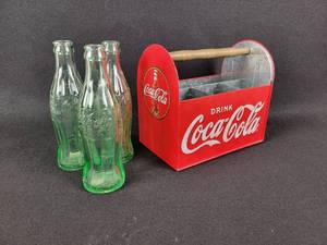 lot 144 image: Coca-Cola Tin Embossed Utensil Caddy w (3) Vintage Coca-Cola Glass Bottles