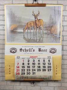lot 24 image: 1979 Schells Beer Wall Calendar - New Ulm, MN - Approx. 31 x 42 - Features Misty Morning by Artist Maynard Reece