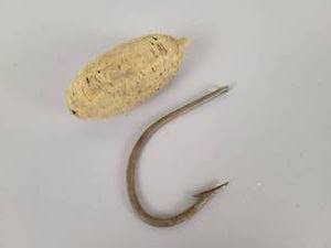 lot 211 image: Vintage Large Pflueger Martu Salt Water Hook and Cork Float