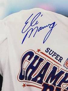 lot 12 image: 2-Time Super Bowl Champion QB Eli Manning Autographed Photo with COA