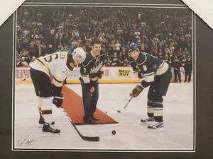 lot 139 image: Professionally Taken Photo of Joe Mauer dropping the puck at a Minnesota Wild game by Photographer Walt Barry