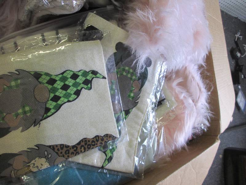 box of new decorative pillow covers...