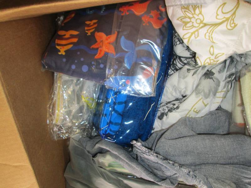 box of new decorative pillow covers...