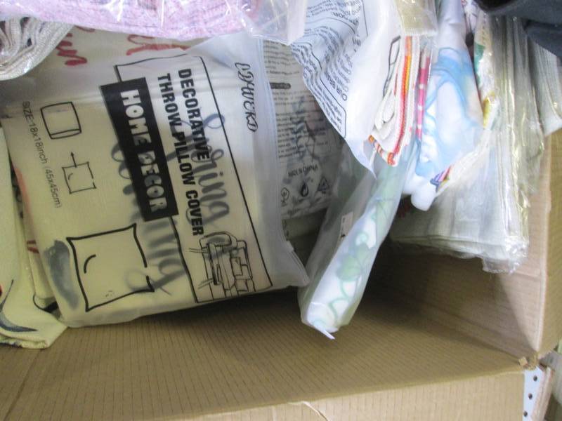 box of new decorative pillow covers...