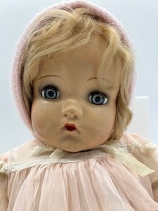 lot 27 image: Vintage Madame Alexander Little Genius Composition Doll