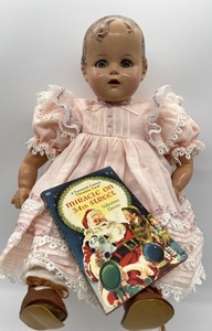 lot 28 image: Vintage Ideal Baby Beautiful Doll with Miracle on 34th Street Book - Pink Dress