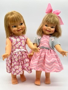 lot 37 image: Pair Vintage Giggles Dolls - Pink  Gray & Pink Daisies