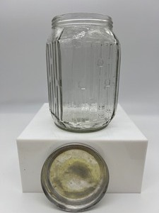 lot 68 image: Vintage Wood Butter Mold, Glass Syrup Jar, Nut Grinder and Jar