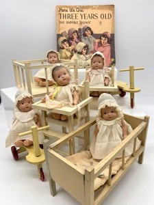 lot 61 image: Vintage Madame Alexander Dionne Quintuplets Dolls & Doll Furniture & BONUS Book