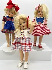 lot 234 image: Vintage Ideal P-91 Toni Dolls - Trio in Reds, Blues & Whites