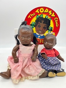 lot 7 image: Vintage Pair Black Americana Composition Topsy Dolls and Advertising Fan