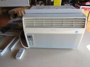 lot 77 image: Sharp Comfort Touch Window Air Conditioner with Remote
